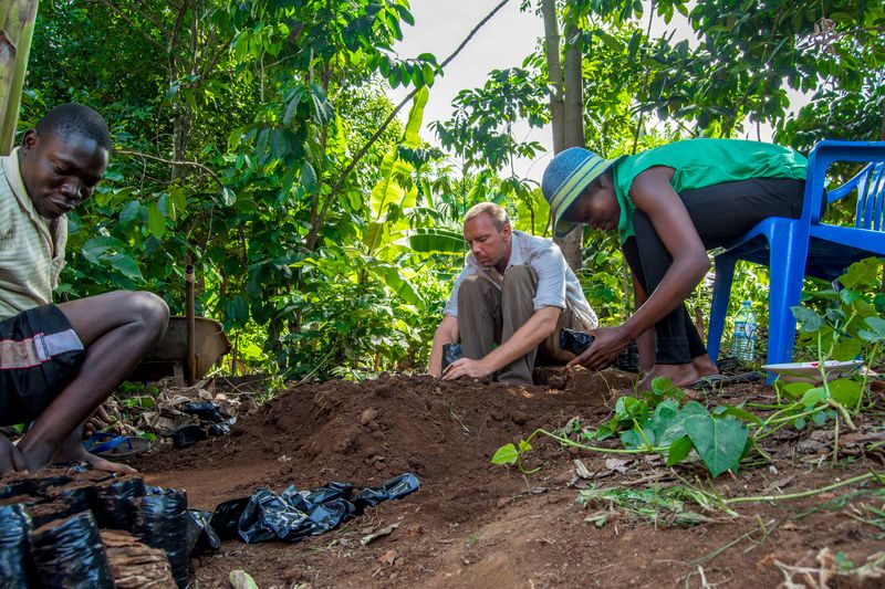 African farmers and partners collaborating in the field